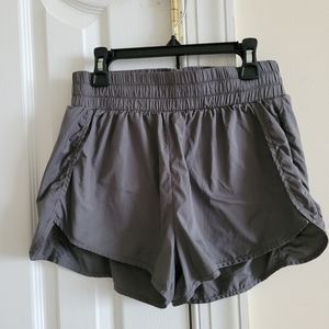 Athletic men double layer running shorts.